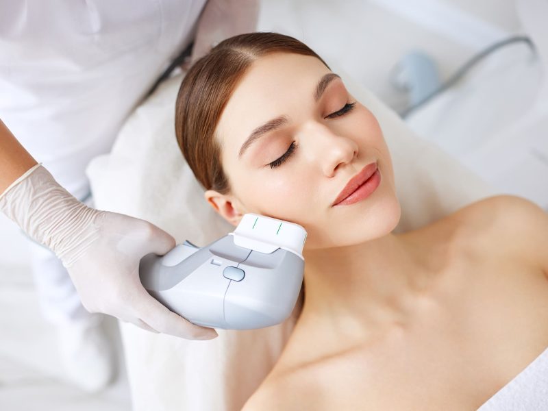 Woman getting facial lifting therapy in beauty salon R 3